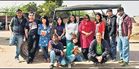 (Left below) Rohan Singh (in green) conducting a heritage walk; (above) Singh (right below) with participants from a group walk at Jodhpur