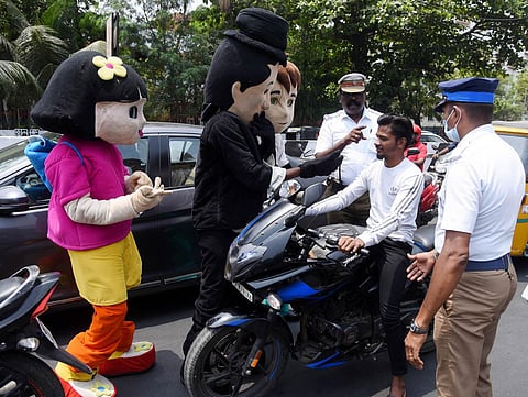 Vepery traffic police use cartoon characters to raise awareness on road safety on Sunday. (Photo | R Satish Babu, EPS)