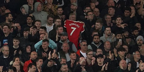 Liverpool fans applaud on the seventh minute in support for Manchester United striker Cristiano Ronaldo and his family during the EPL match at Anfield Stadium in Liverpool. (Photo | AP)