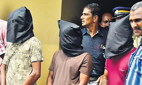 The arrested trio at Kasaba police station in Palakkad, on Tuesday