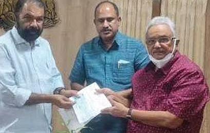 Andhra Pradesh former DGP A P Rajan hands over the cheque to General Education Minister V Sivankutty in the presence of Punalur MLA SSupal | Express