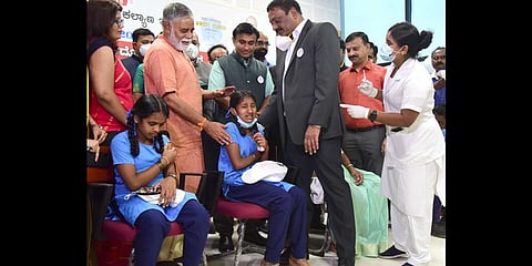 Children in the 12-14 age-group get their shots of the Corbevax vaccine at Atal Bihari Vajpayee Medical College, in Bengaluru. (File photo| EPS)