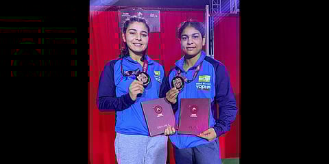 Sarita Mor and Sushma Shokeen pose for photographs after winning bronze medals at the Asian Wrestling Championship in Ulaanbaatar, Mongolia .(Photo | PTI)