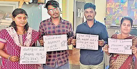 Citizens hold placards condemning the demolition of houses and other structures in Delhi’s Jahangirpuri locality, in Bengaluru on Thursday