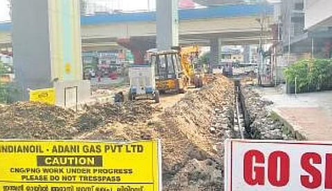 A long queue of vehicles coming from Vyttila Mobility Hub wait at the junction near the northern entrance to the Metro station