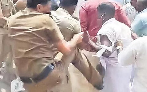 Cop in dock for kicking protester 