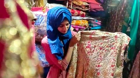 Shaharabanu shows one of the many bridal outfits which is available at The Rainbow Free Bridal Boutique, opened just weeks ago. (Photo | Express)