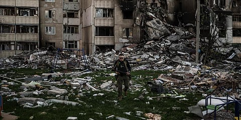 A Ukrainian serviceman walks amid the rubble of a building heavily damaged by multiple Russian bombardments near a frontline in Kharkiv, Ukraine. (Photo | AP)