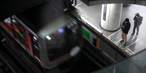 Passengers wait at platform for their trains arrival at Tokyu Railways' Shibuya Station. (Photo | AP)