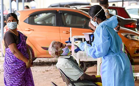 A health worker collecting nasal swab sample for Covid-19 testing in Tiruchy on Tuesday | M K Ashok Kumar