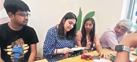 Members of The Abstract Room engrossed in discussions at a meet-up in Mumbai