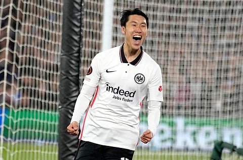 Both clubs are Frankfurt's Daichi Kamada celebrates after scoring his side's second goal during the Europa League semi final. (Photo | AP)