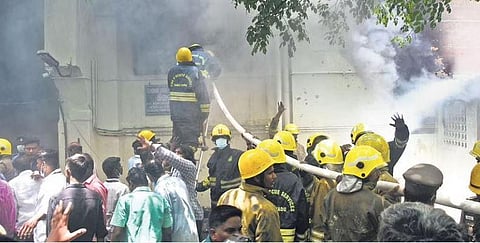 Firemen trying to put out the blaze at Bradfield surgical block