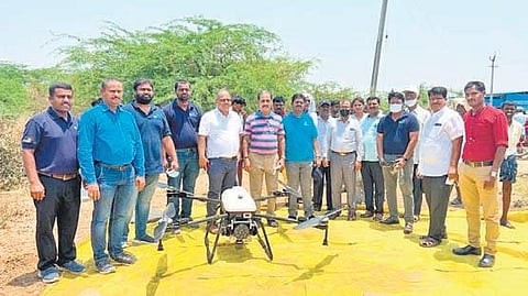 A drone sprayer inauguration and farmer awareness programme in Mundlapadu village of Giddalur mandal. (Photo | EPS)