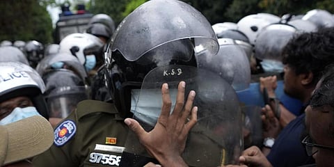 Students scuffle with police during a protest demanding president Gotabaya Rajapaksa's resignation near parliament in Colombo, Sri Lanka. (Photo | AP)