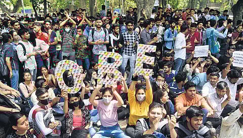 DU students protest at art faculty of the university on Monday, demanding open book exams | Parveen Negi