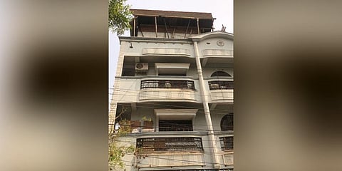 The building owner Srinivas Yadav has taken up work for constructing a storage tank on the terrace of the building. (Photo | EPS)