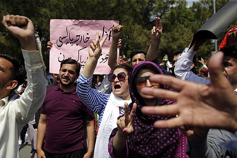 Supporters of ruling party Pakistan Tehreek-e-Insaf (PTI) chant slogans during a protest in Islamabad, Pakistan, Sunday, April 3, 2022. (Photo | AP)