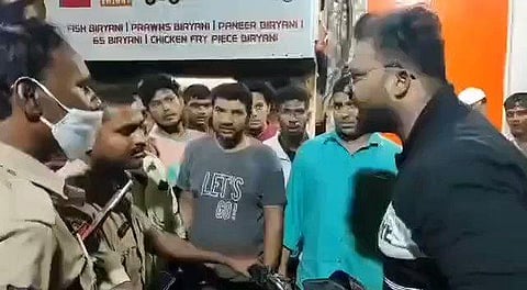 AIMIM corporator Mohammed Ghousuddin (R) argues with cops in Hyderabad. (Photo| Twitter)