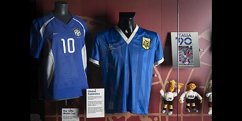 The shirt worn by Maradona (centre) when he scored the controversial “Hand of God” goal against England in the 1986 World Cup is for sale for the first time.(File Photo | AP)