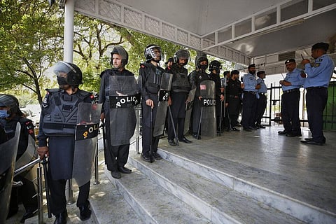 Security personnel stand guard outside the Supreme Court where the hearing of petitions for dissolving parliament by country's Prime Minister is going on,  on April 7,2022(Photo | AP)
