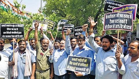 Cab drivers shout slogans during a protest at Jantar Mantar on Friday | Express