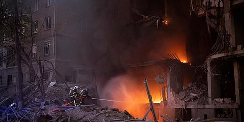 Firefighters try to put out a fire following an explosion in Kyiv, Ukraine. Image used for representational purpose only. (Photo | AP)