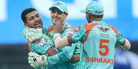 Mohsin Khan of Lucknow Super Giants celebrates with teammates after the wicket of Rishabh Pant, captain of Delhi Capitals, during the IPL match at the Wankhede Stadium in Mumbai. (Photo | PTI)