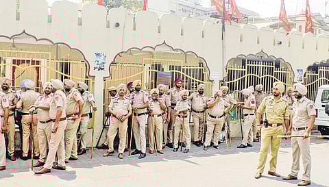 Police stand guard outside a temple, a day after clashes in Patiala | PTI