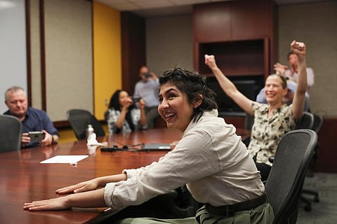 Cecilia Reyes, of the Chicago Tribune, reacts as she and Madison Hopkins, not pictured, win the Pulitzer Prize in Local Reporting. (Photo |AP)