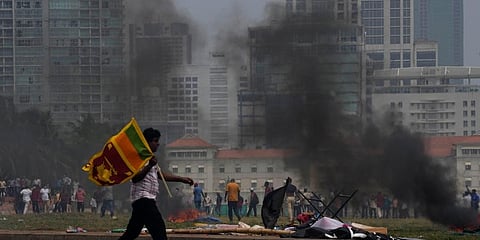 Violence erupted after supporters of Mahinda Rajapaksa attacked peaceful anti-government protesters.  (Photo | AP)