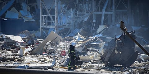 An Ukrainian firefighter works near a destroyed building on the outskirts of Odesa, Ukraine. (Photo | AP)
