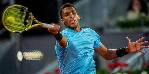 Felix Auger-Aliassime returns the ball against Alexander Zverev during their match at the Mutua Madrid Open tennis tournament in Madrid, Spain. (Photo | AP)