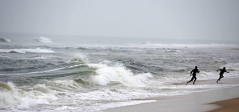 Boys enjoy the sea waves at Chennai's Pattinampakkam beach amid cloudy weather. (Photo| R Satish Babu, EPS)
