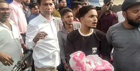 Family members of the deceased children stage a protest at the hospital. 