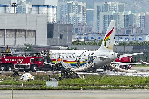 Passenger jet that veered off a runway during take-off and caught fire is seen in the aftermath in Chongqing Jiangbei International Airport in southwestern China's Chongqing (Photo | AP)