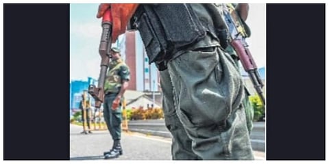 Soldiers stand guard at a check point in Colombo on Wednesday. (Photo | AFP)