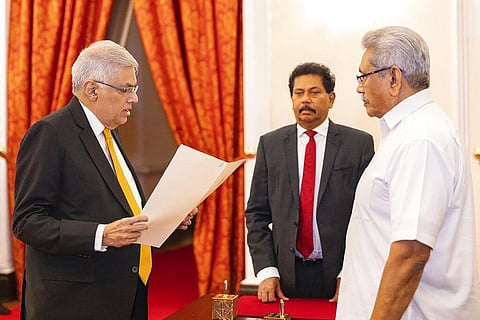 Sri Lankan President's Office, President Gotabaya Rajapaksa, right, watches Ranil Wickremesinghe take the oath of office as the new prime minister in Colombo, Sri Lanka(Photo | AP)