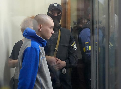 Russian army Sergeant Vadim Shishimarin, 21, is seen behind a glass during a court hearing in Kyiv. (Photo | AP)