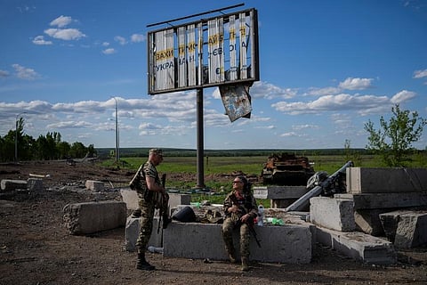 Members of the Ukrainian territorial defence force guard a position in north Kharkiv, Ukraine. (Photo | AP)