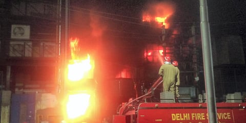 Firefighters try to douse a fire that broke at a plastic granulation factory at Narela, in New Delhi. (Photo| ANI)