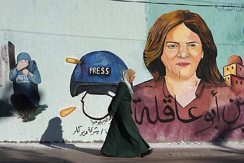 A mural of slain of Al Jazeera journalist Shireen Abu Akleh adorns a wall, in Gaza City, Sunday, May 15, 2022.(Photo | AP)