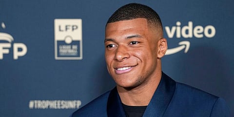 Paris Saint Germain's Kylian Mbappe poses as he arrives at the Union of French Professional Footballers ceremony, in Paris, France. (Photo | AP)