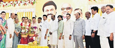 MK Stalin with the bride and groom at Kalaignar Arangam on Sunday | Express