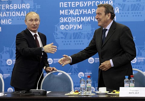 Russian President Vladimir Putin, left, and Germany's former Chancellor Gerhard Schroeder. (File Photo | AP)