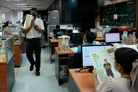 Bangkok governor independent candidate Chadchart Sittipunt, left, introduces himself during an election campaign in Bangkok, Thailand. (Photo | AP)