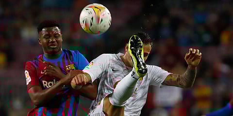 Barcelona's Ansu Fati (L) challenges for the ball with Mallorca's Franco Russo (R) during a La Liga match at the Camp Nou stadium in Barcelona. (Photo| AP)
