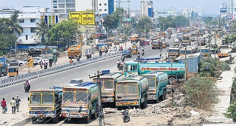 Trucks illegally parked on either sides of Pallavaram Radial Road. (Photo | EPS, Ashwin Prasath)