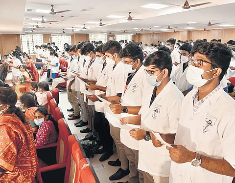 First-year students at the Madurai Medical College taking the Maharishi Charak Shapath oath on Saturday. (Photo | EPS)