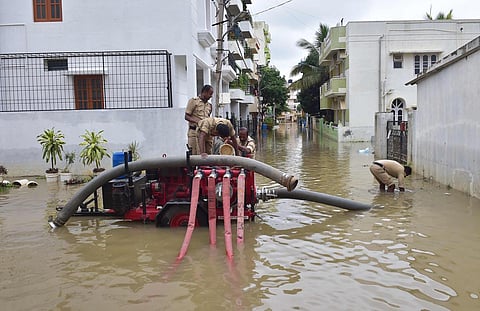 Fire and Emergency department personnel pump out water from flooded areas in Horamavu Layout. (Photo | Vinod Kumar T, EPS)